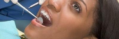 Dentist examining a patient's teeth in Middletown, NJ