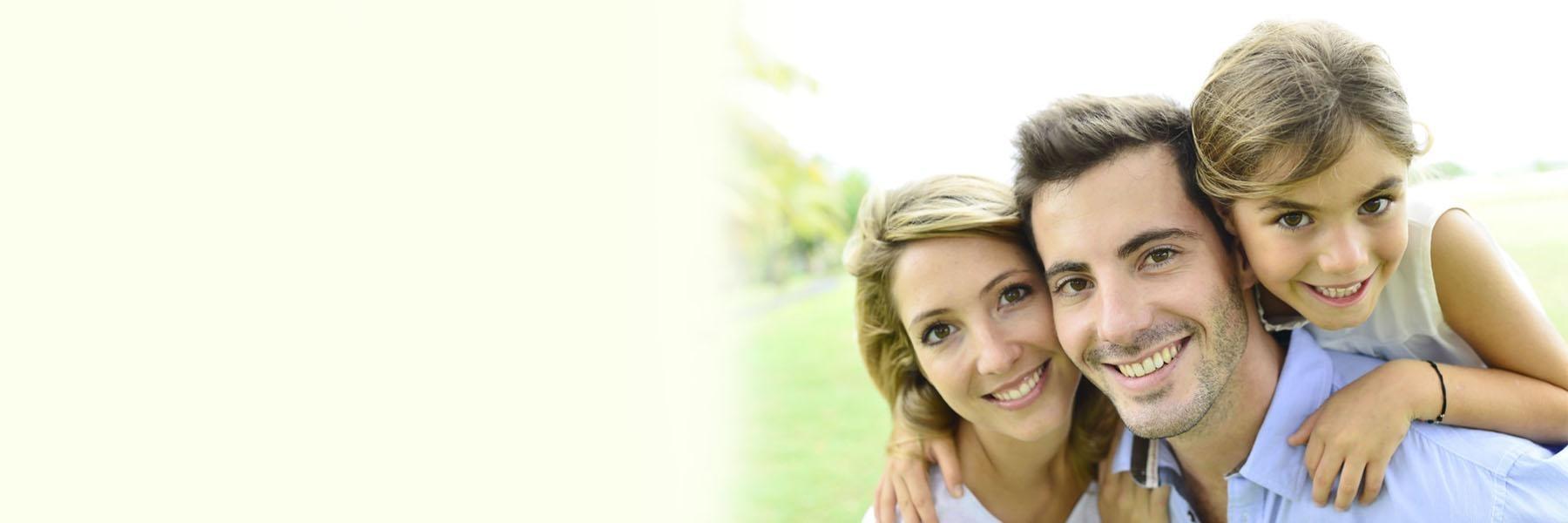 Family smiling after teeth whitening in Middletown,NJ