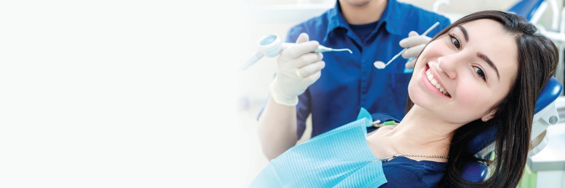 Patient smiling during teeth cleaning in Middletown, NJ