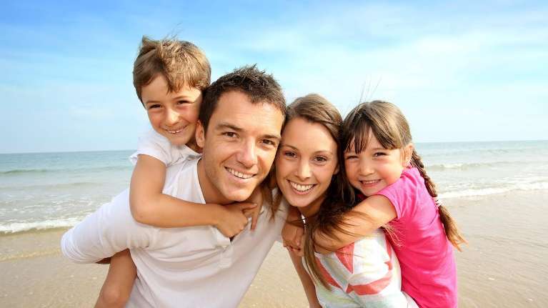 Family poses for a photo after visiting Middletown Dental, NJ