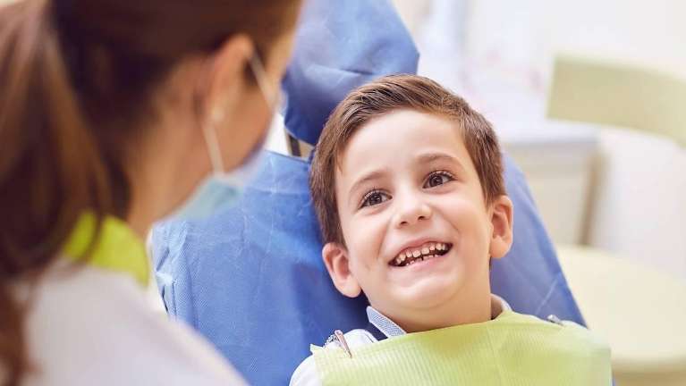 Child smiling during dental check up at Middletown Dental