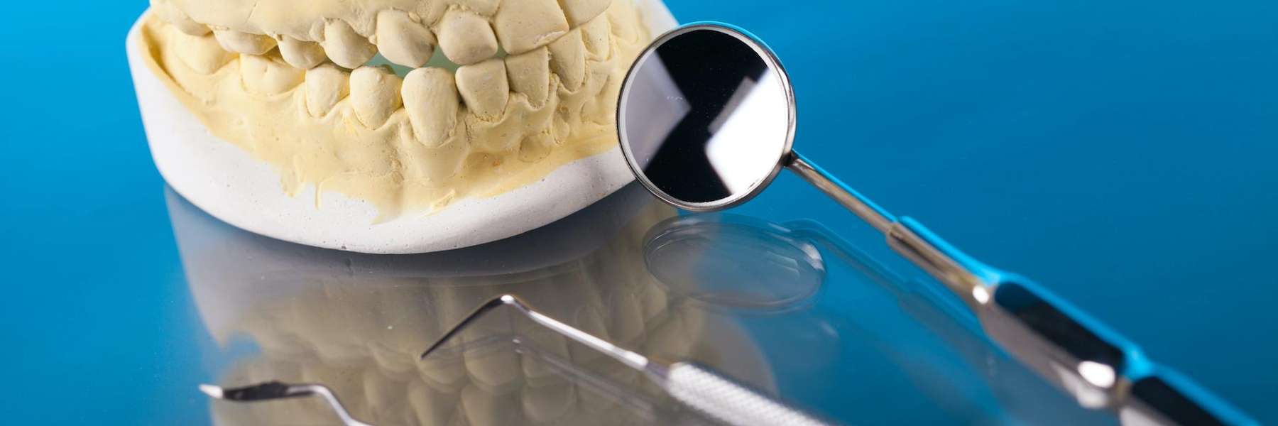 Picture of tooth extraction equipment and a tooth in Middletown, NJ