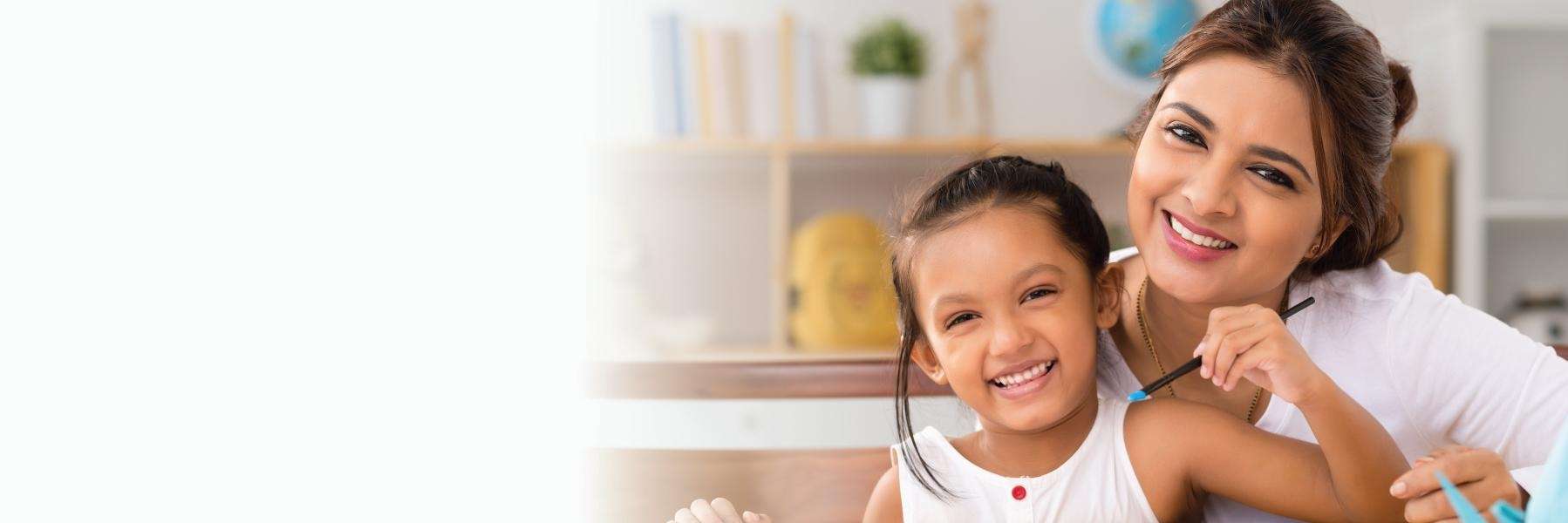 Mother and her child smiling after dental check up at Middletown Dental